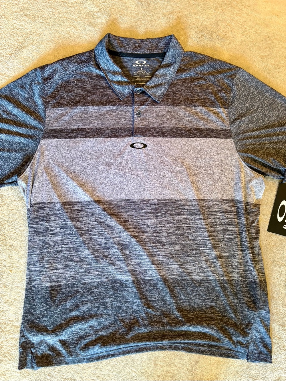 Brand new Oakley Heathered Purple and Gray Striped Performance Polo, with tags